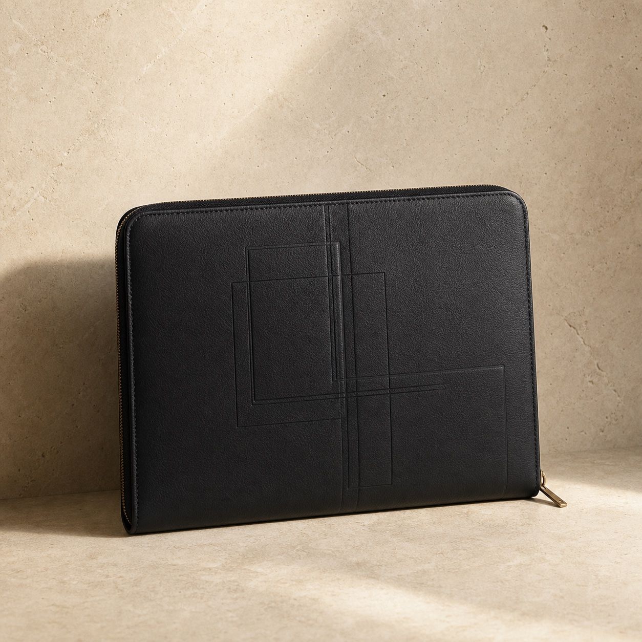 Concept black leather Steward Folio on warm limestone